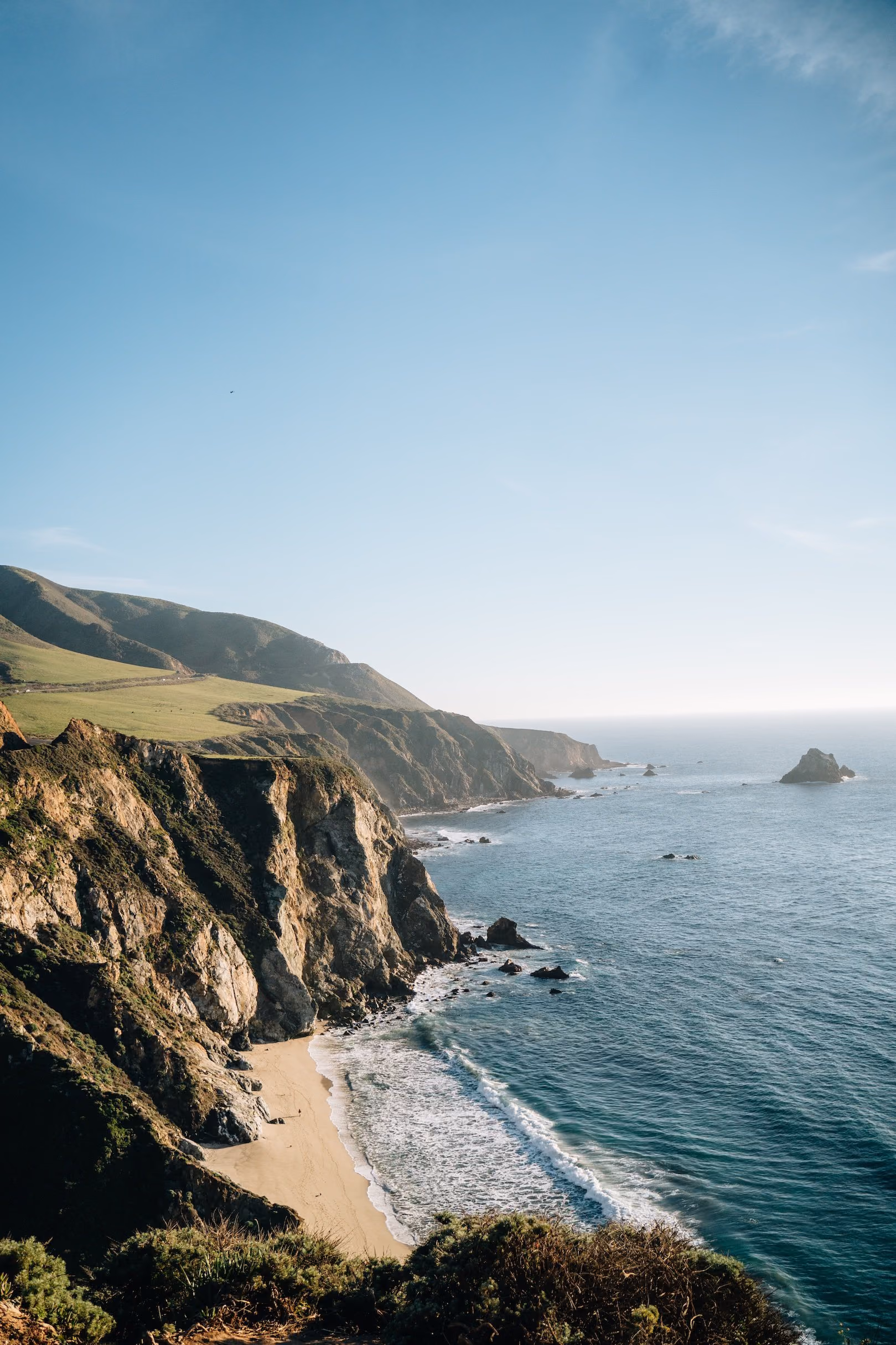 Cliffs of the Big Sur coast meeting the Pacific in afternoon light